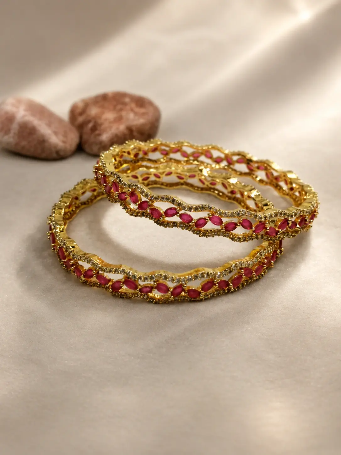 golden bangles with red nags
