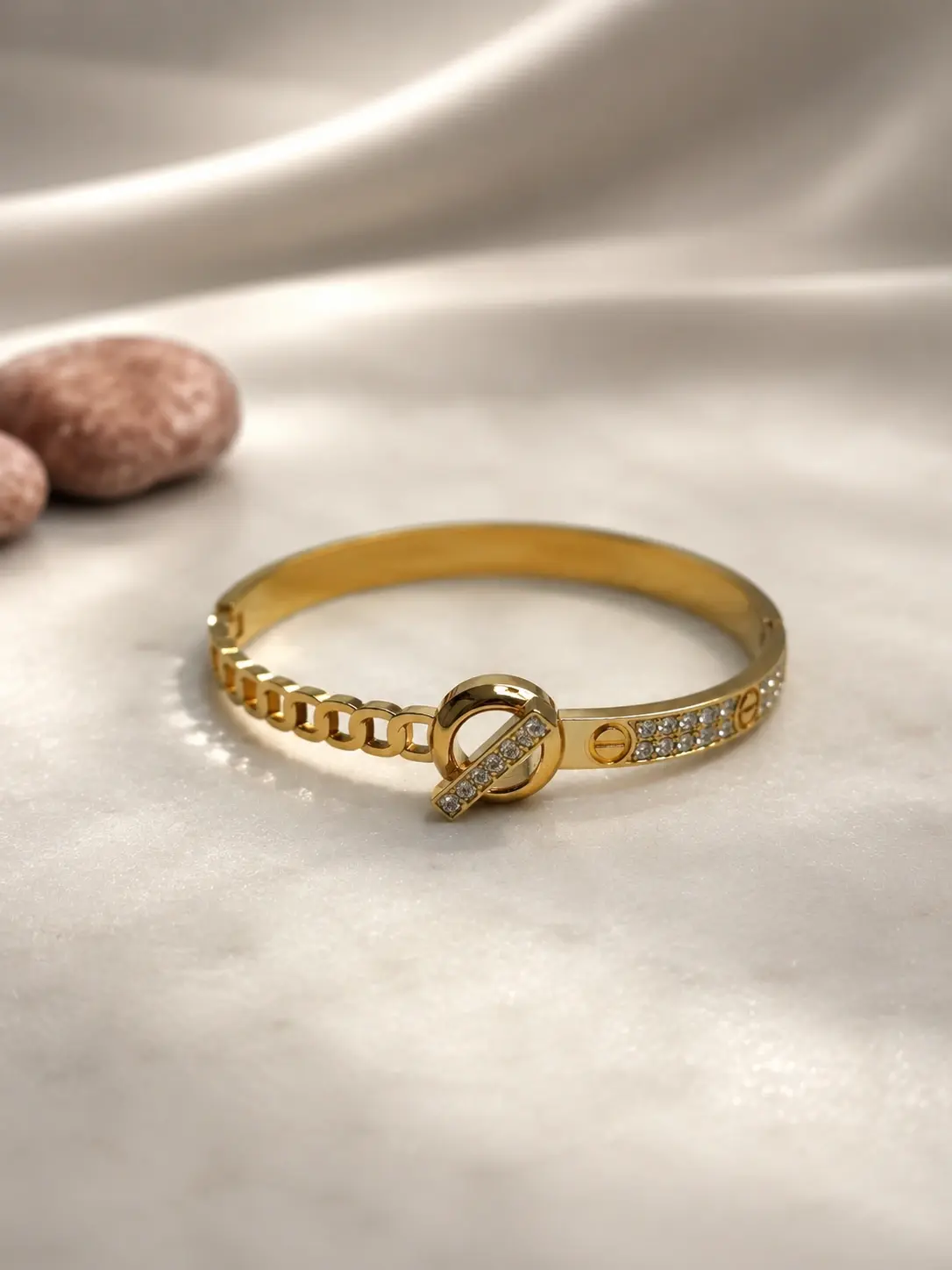 gold knot chain stone bangle with clear accent center