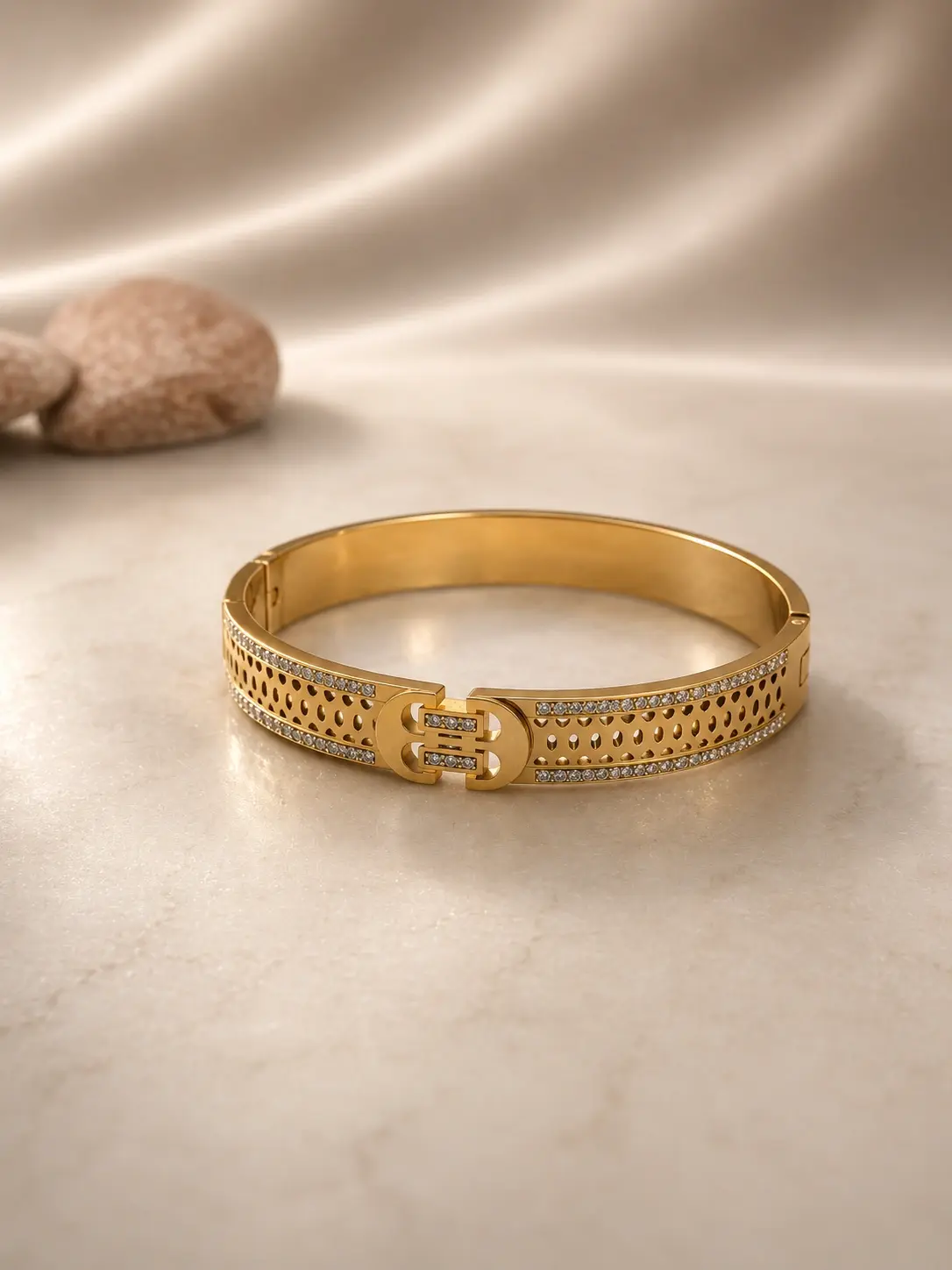 gold tone openwork stone bangle with clear accent rows