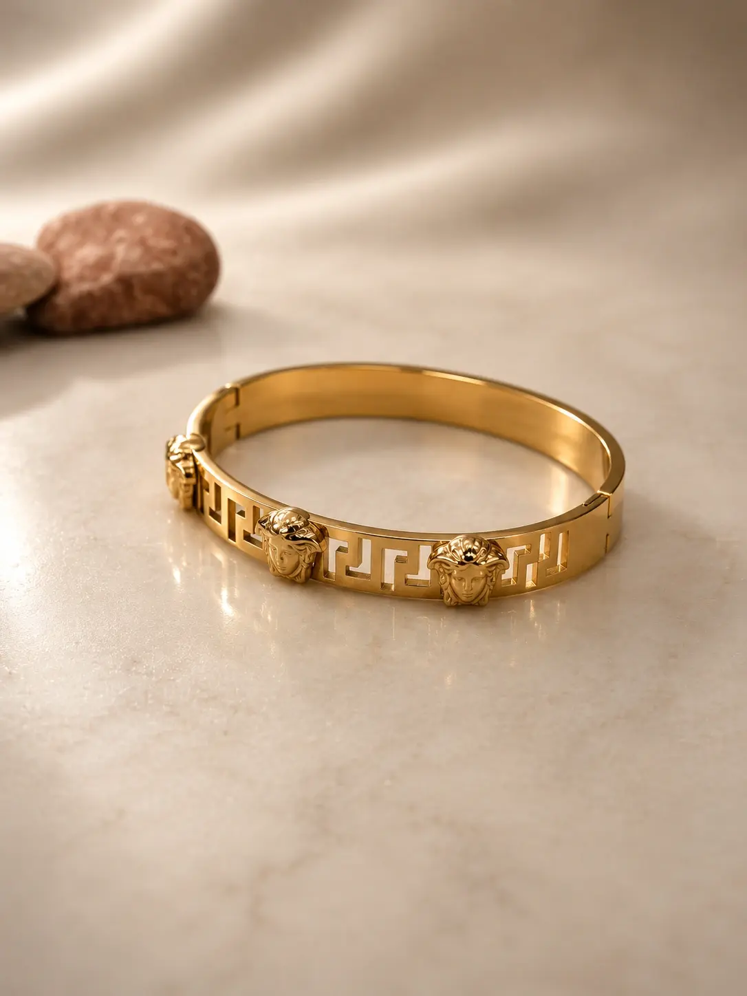 gold face Greek key bangle with three classical motifs