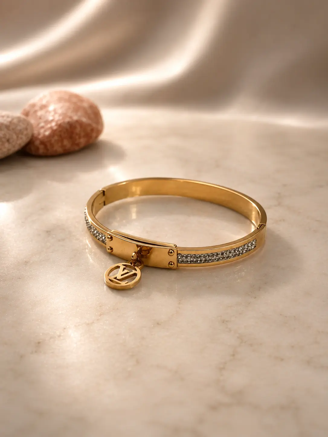 gold tone monogram charm stone hinged bangle with clear accents