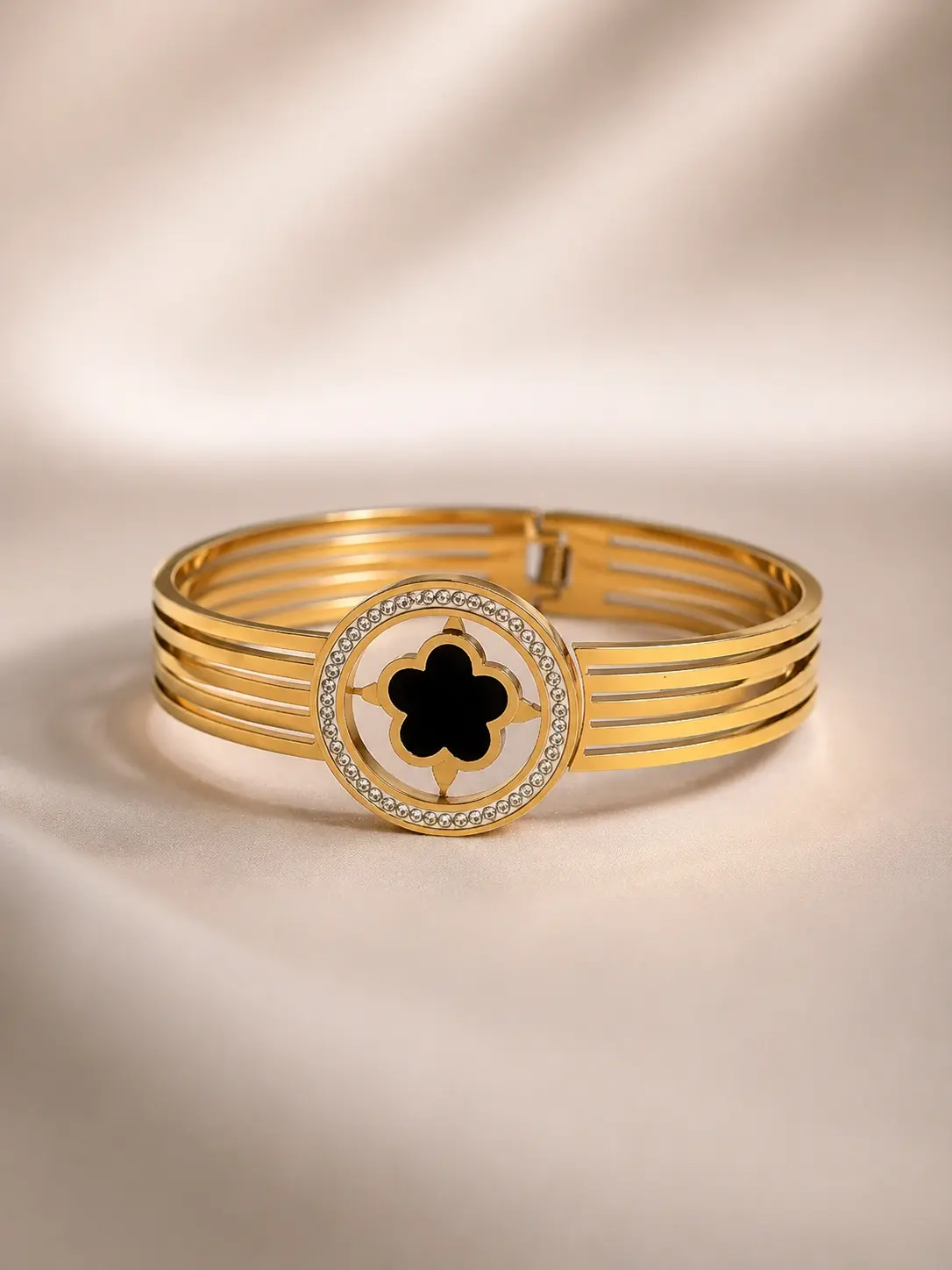 gold tone black clover halo multi band cuff with clear accents