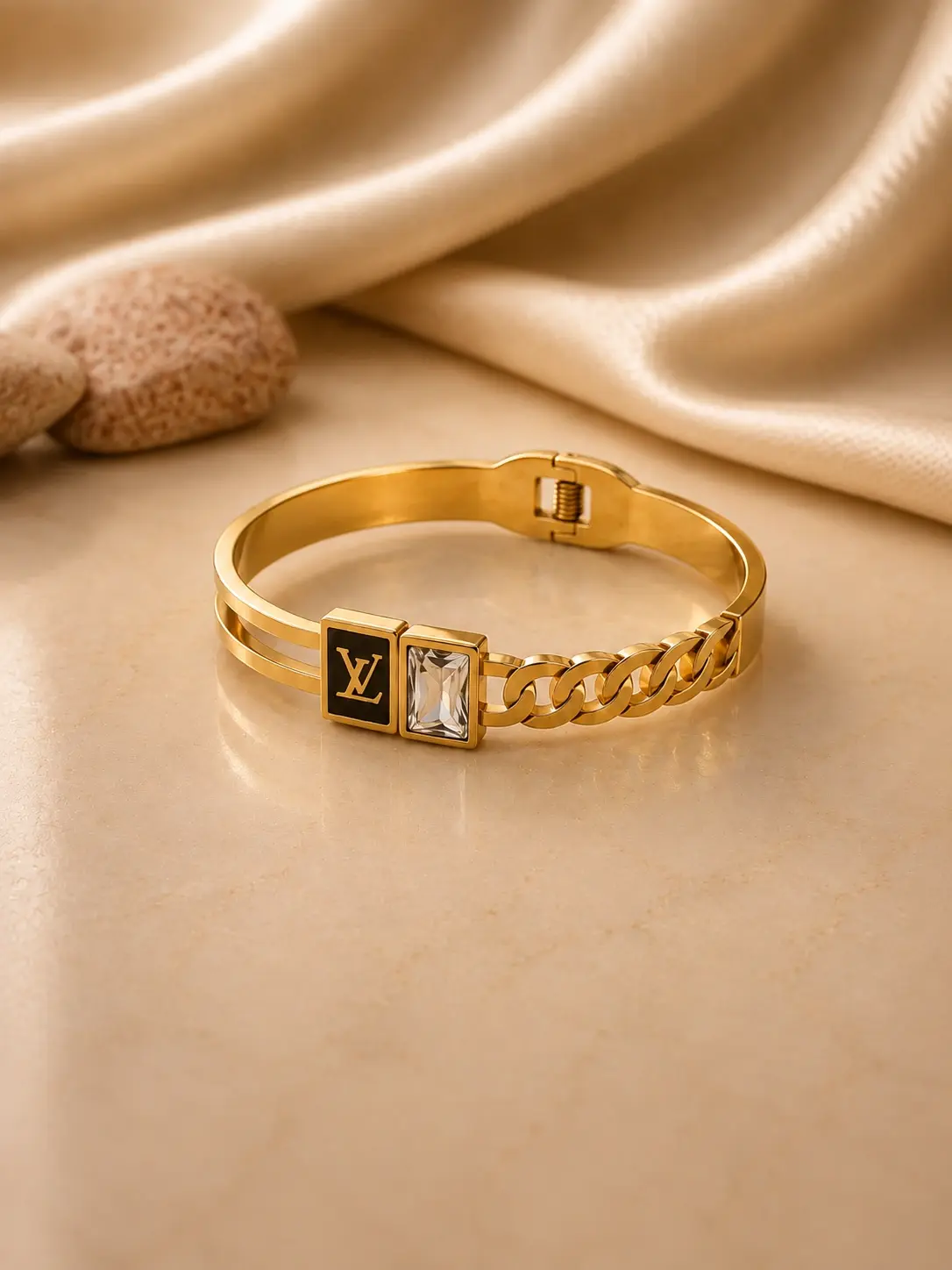 gold tone black monogram chain link bangle with clear rectangular accent