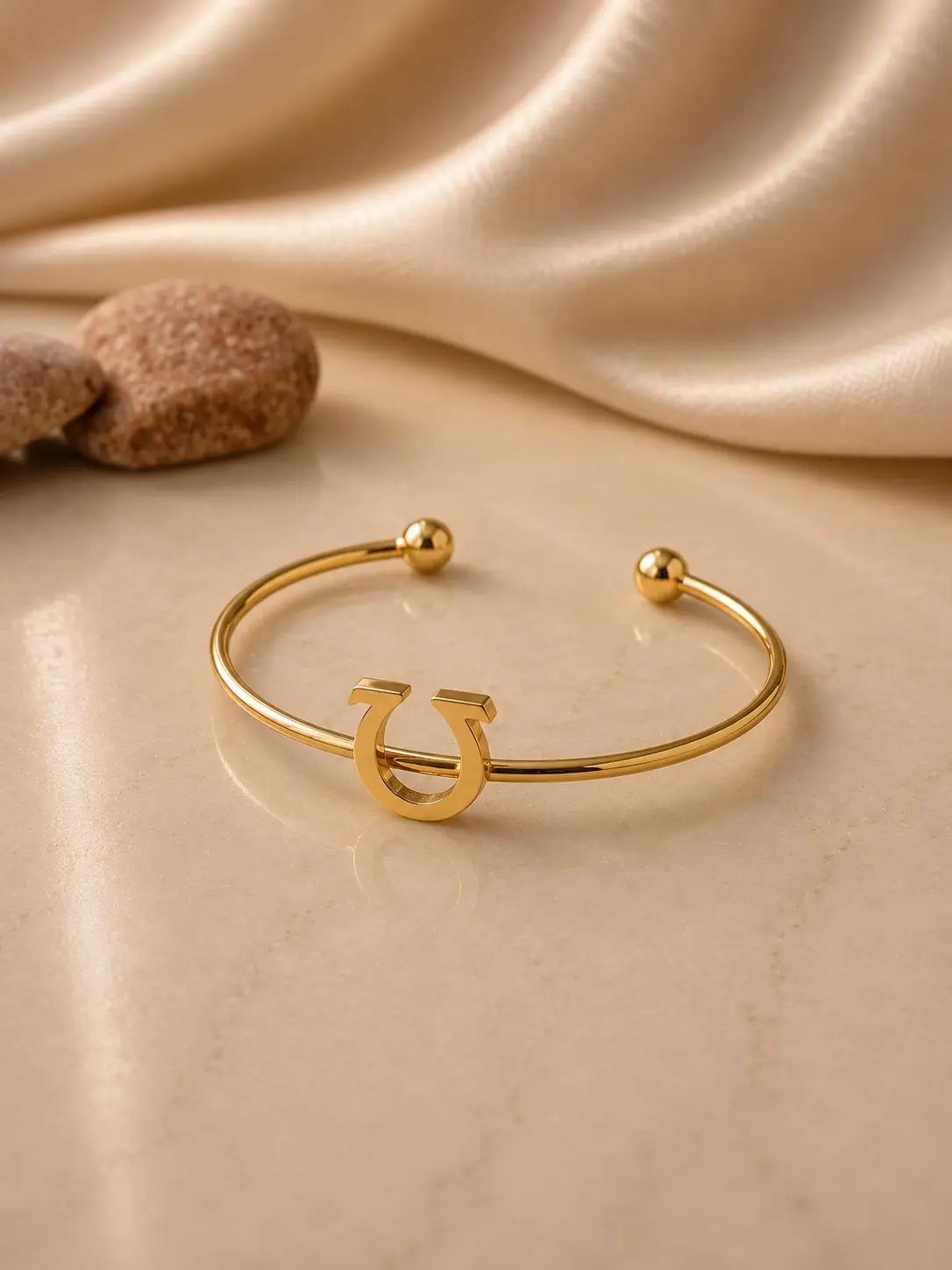 gold tone horseshoe open cuff bracelet with polished ball ends