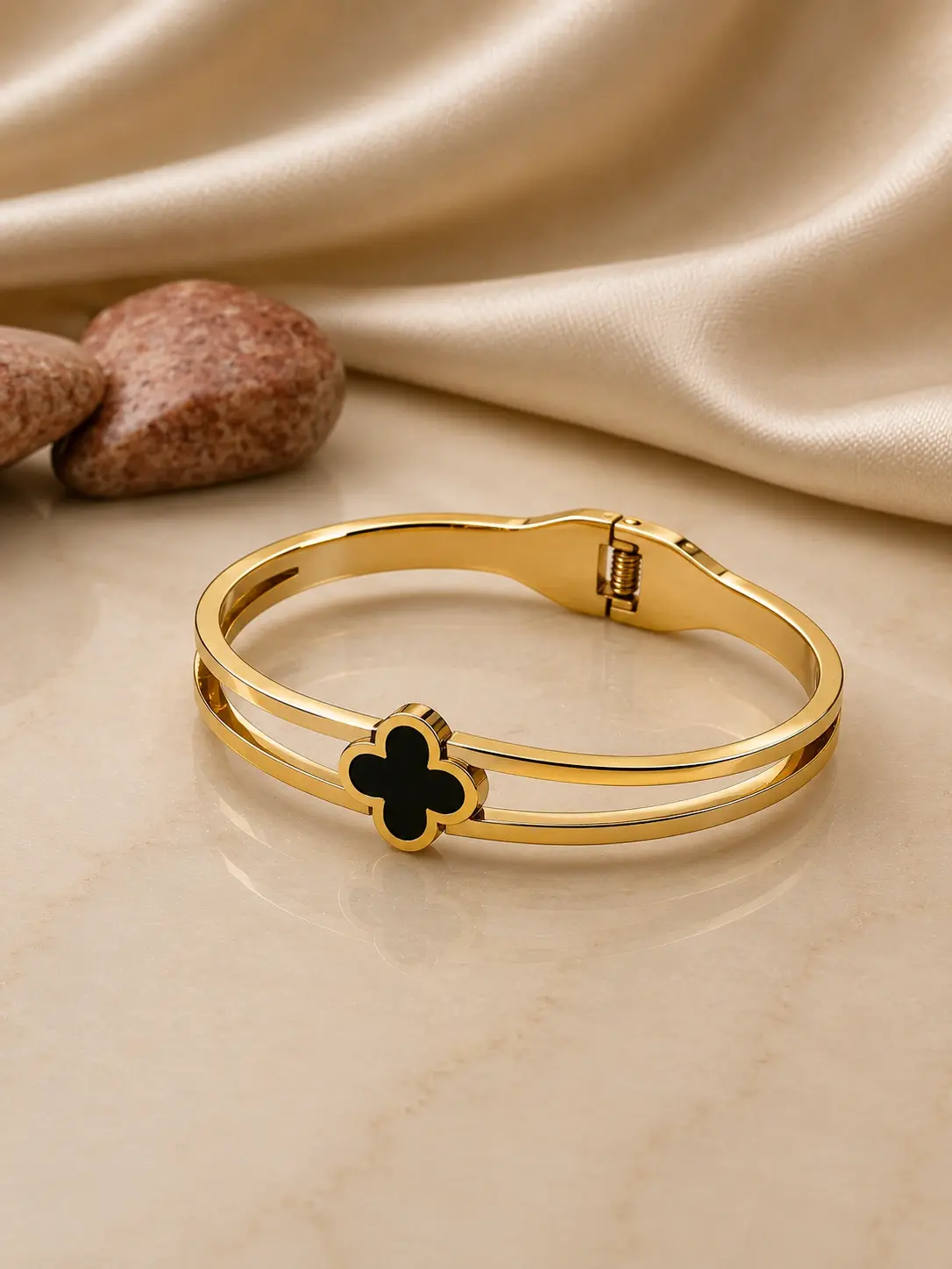 gold tone black clover double band bangle with hinged closure