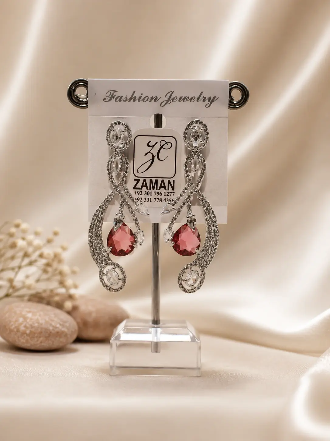Pink Teardrop Ribbon Cascade Earrings with clear oval details and silver-tone curves