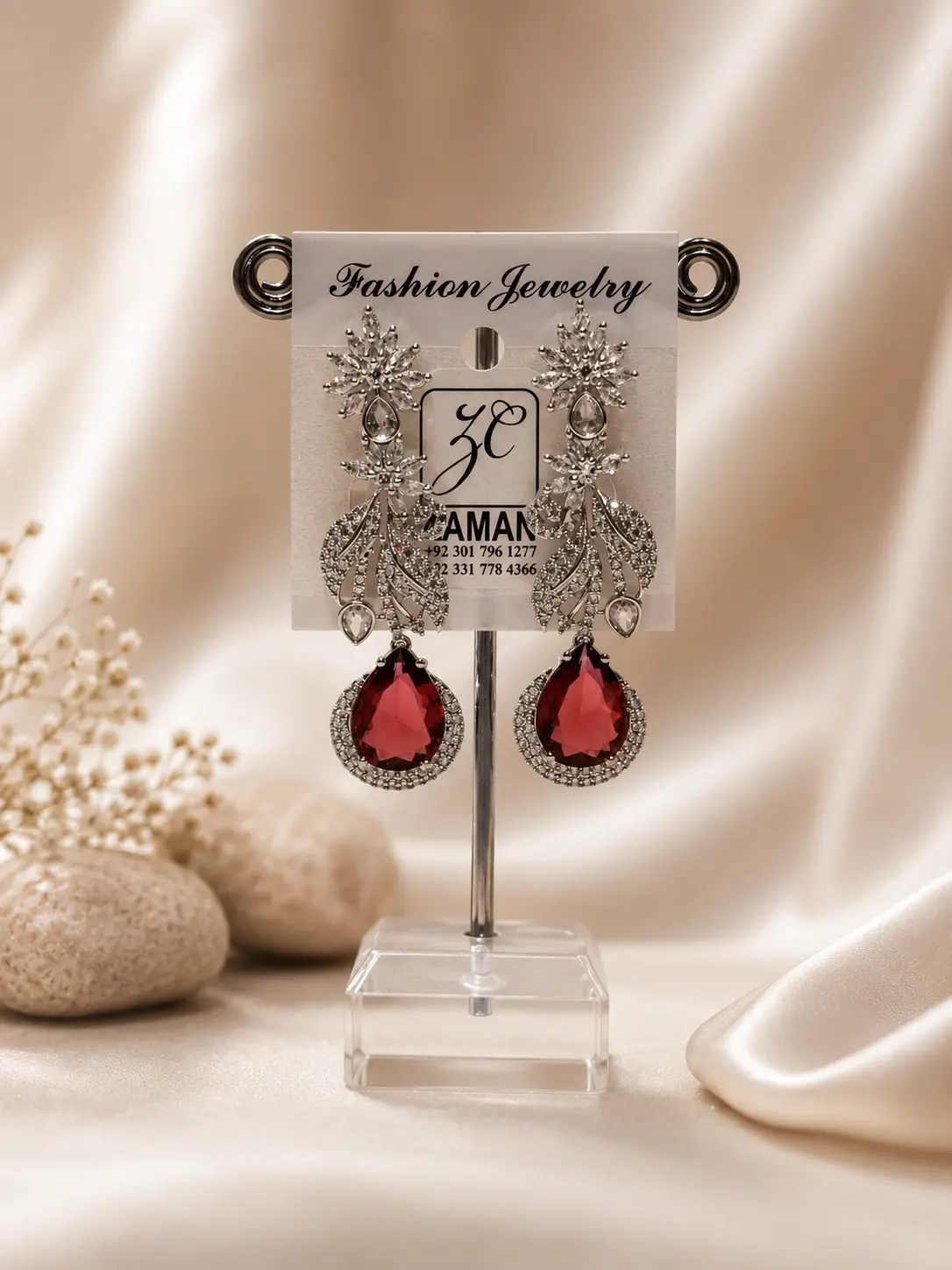 Red Teardrop Feather Drop Earrings with clear leafy details and silver-tone borders