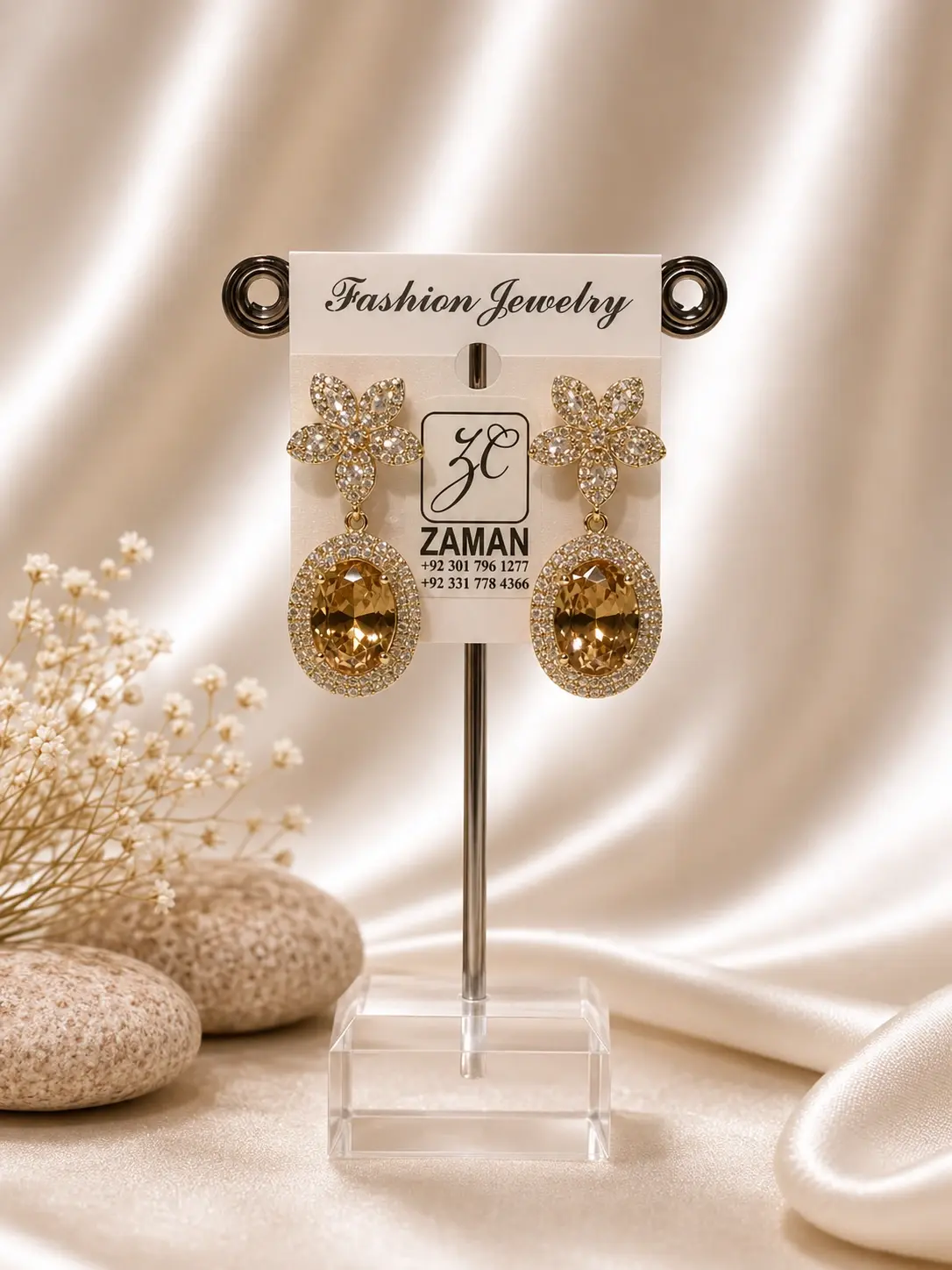 Amber Oval Floral Drop Earrings with clear flower tops and golden-brown oval centers