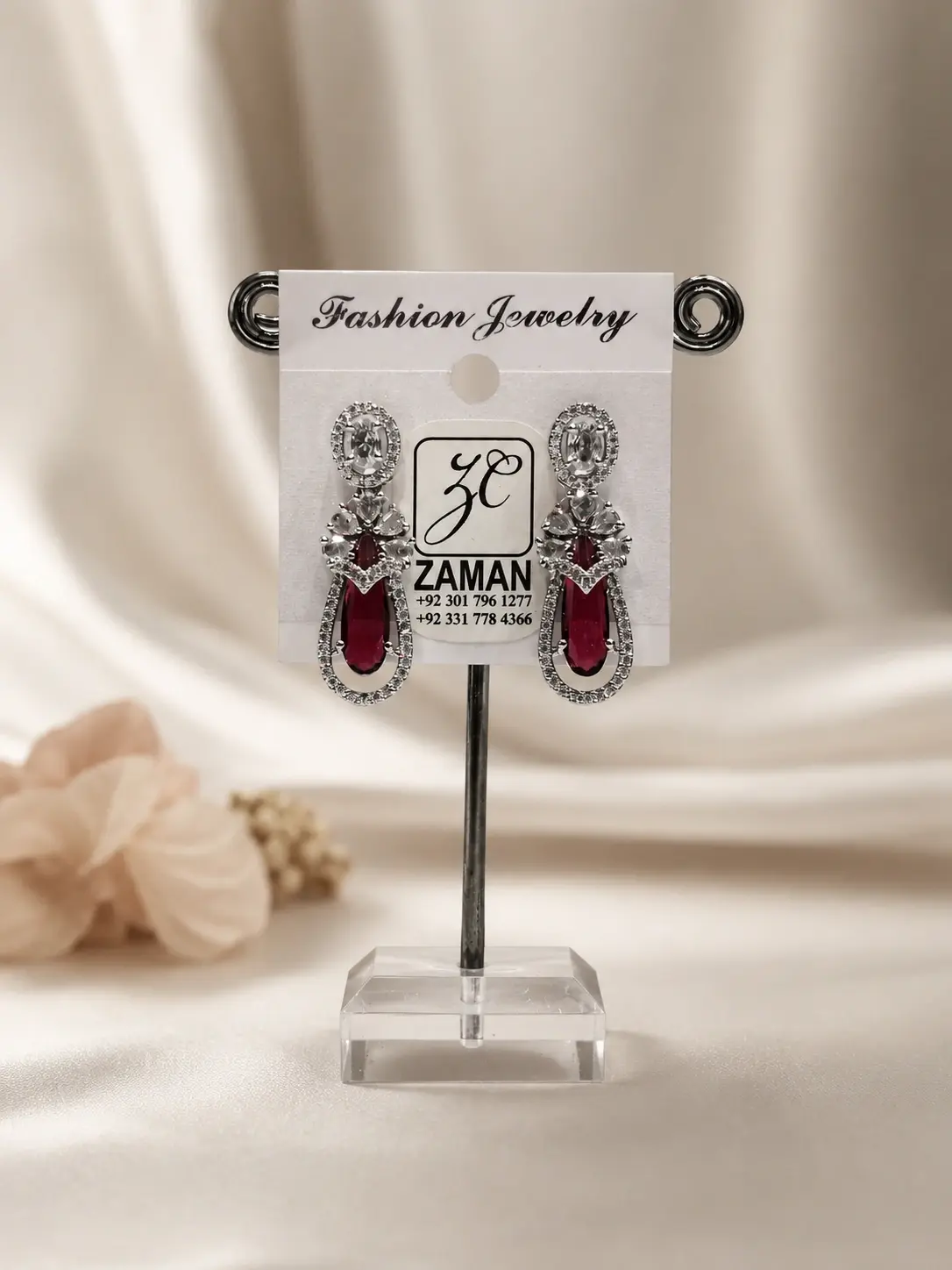 Red Teardrop Floral Drop Earrings with deep red centres and detailed silver-tone borders