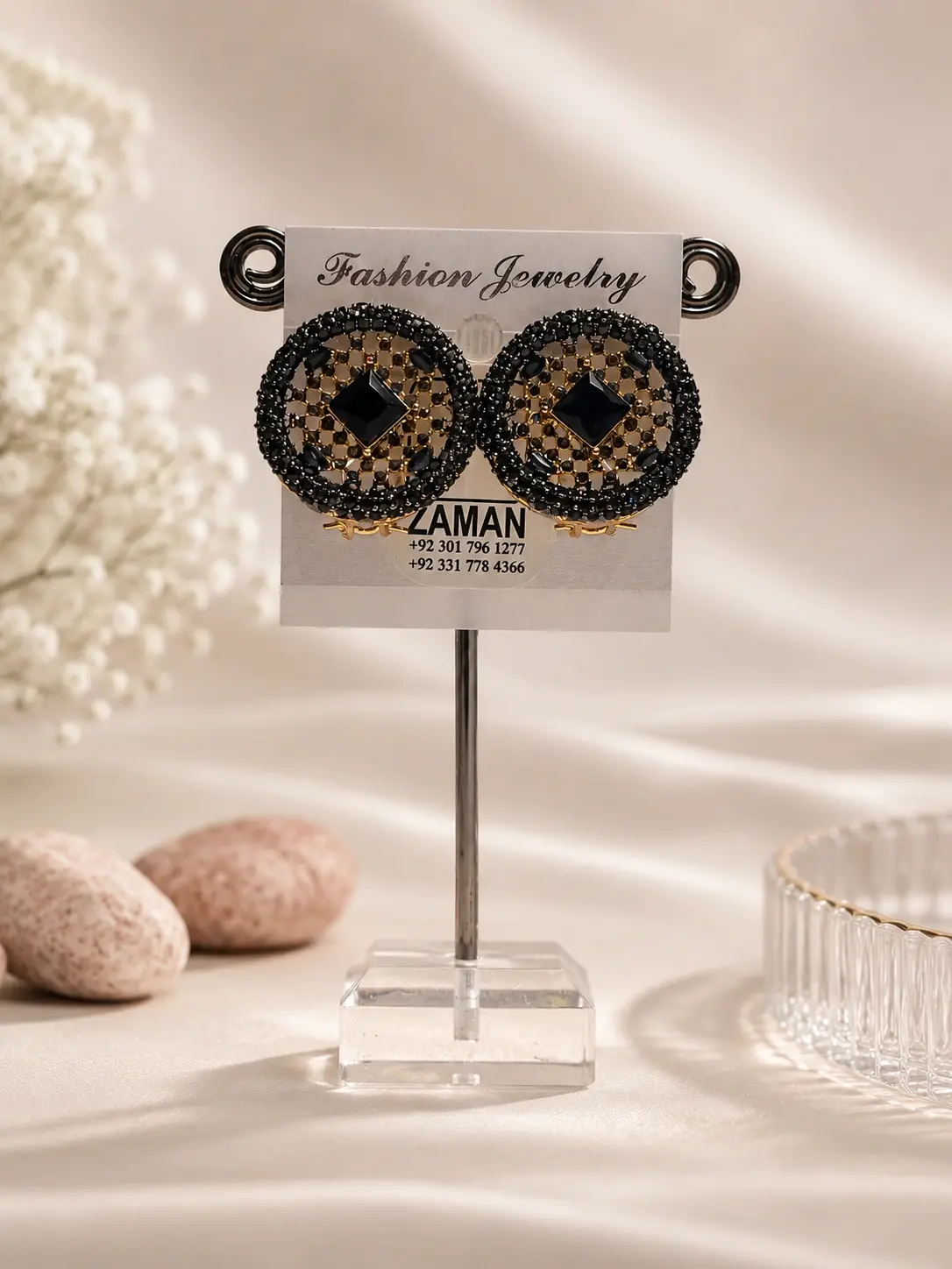Black Lattice Medallion Stud Earrings with gold-tone gridwork and central square details