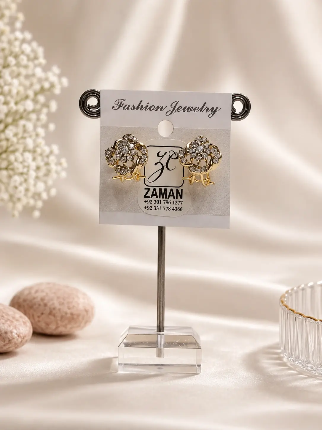 Gold Openwork Floral Cluster Stud Earrings with curved outlines and clear decorative accents