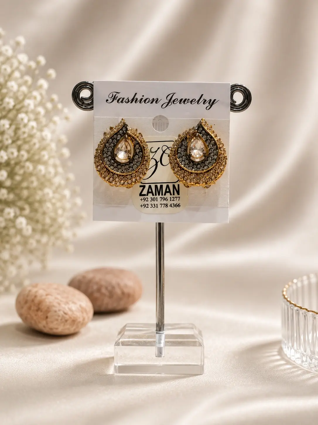 Gold Teardrop Crescent Stud Earrings with clear centers and layered smoky decorative borders