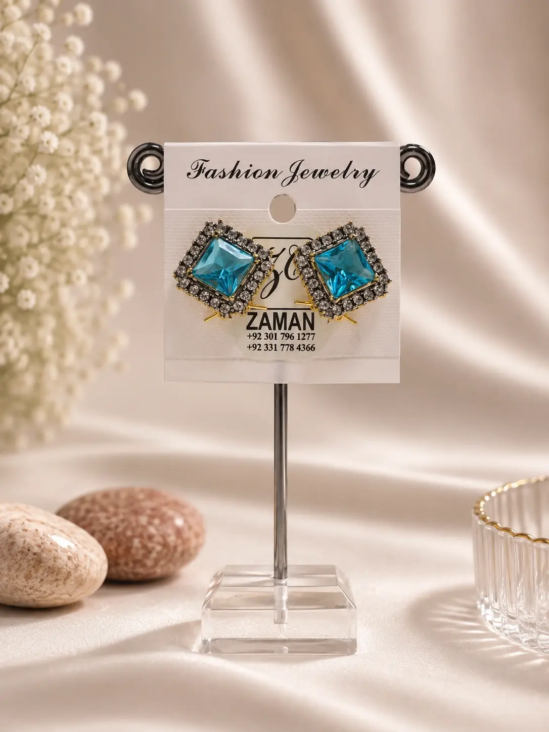 Blue Square Halo Stud Earrings with aqua centers and detailed dark-and-clear borders