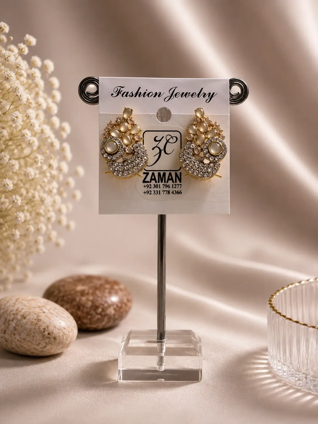 Gold Paisley Bead Cluster Earrings with creamy oval details and clear decorative accents