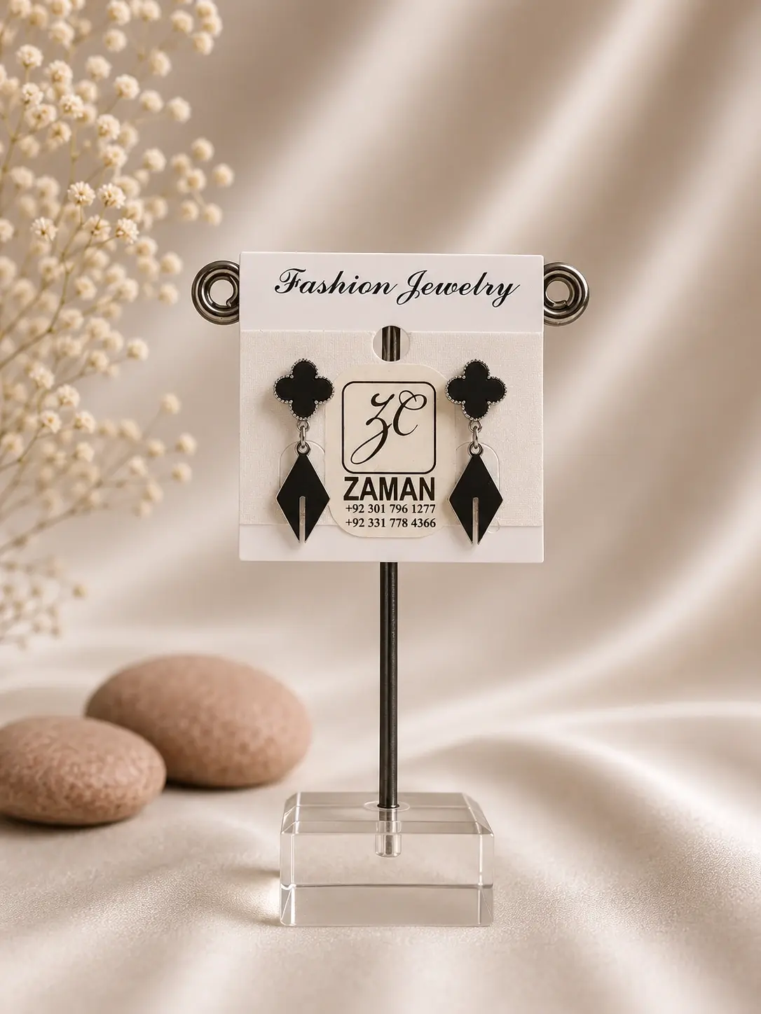 Black Clover Spear Drop Earrings with four-lobed tops and pointed geometric black drops