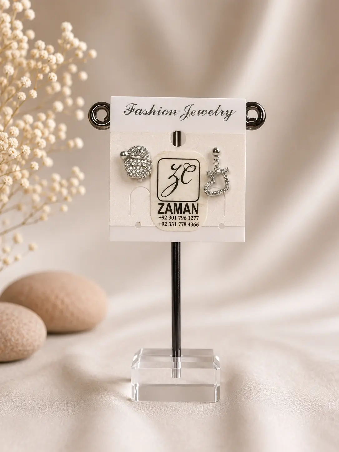 Silver Planet Bow Earrings with a ringed planet stud and bow-topped hanging charm