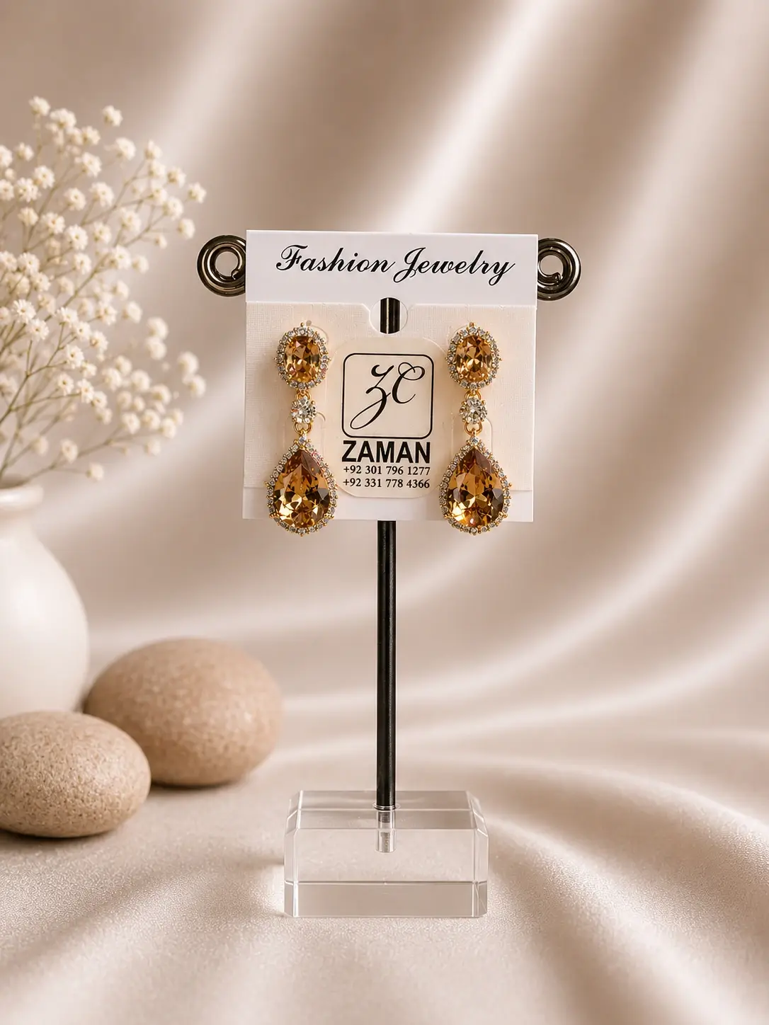 Champagne Oval Teardrop Halo Earrings with clear borders and gold-tone connectors