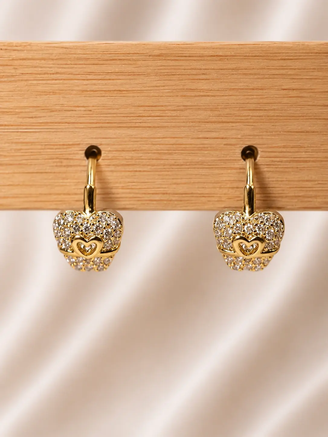 Gold Apple Heart Drop Earrings with clear stone clusters and nested heart-shaped details