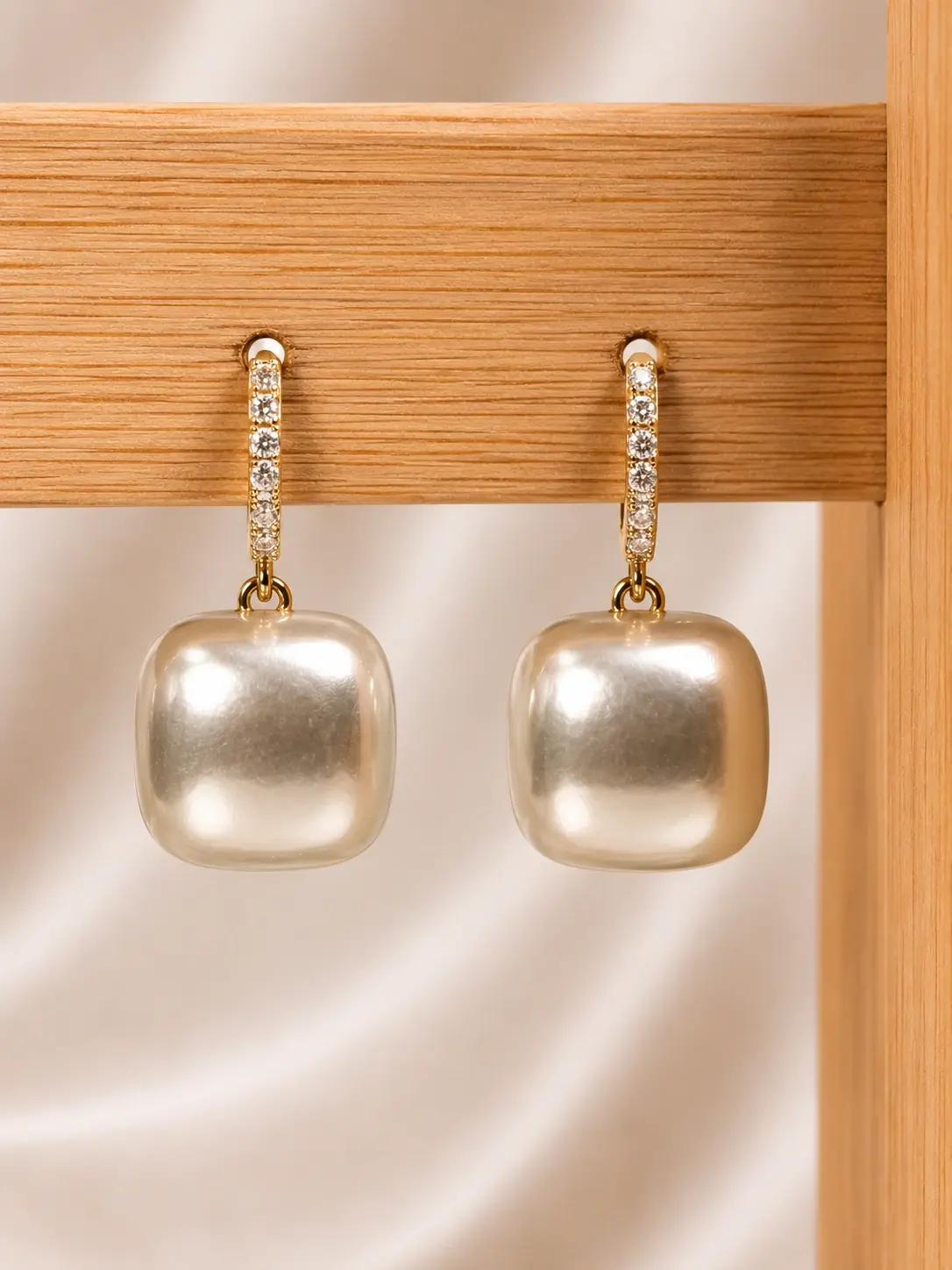 Gold Square Bead Drop Earrings with clear stone hoops and creamy white rounded-square drops