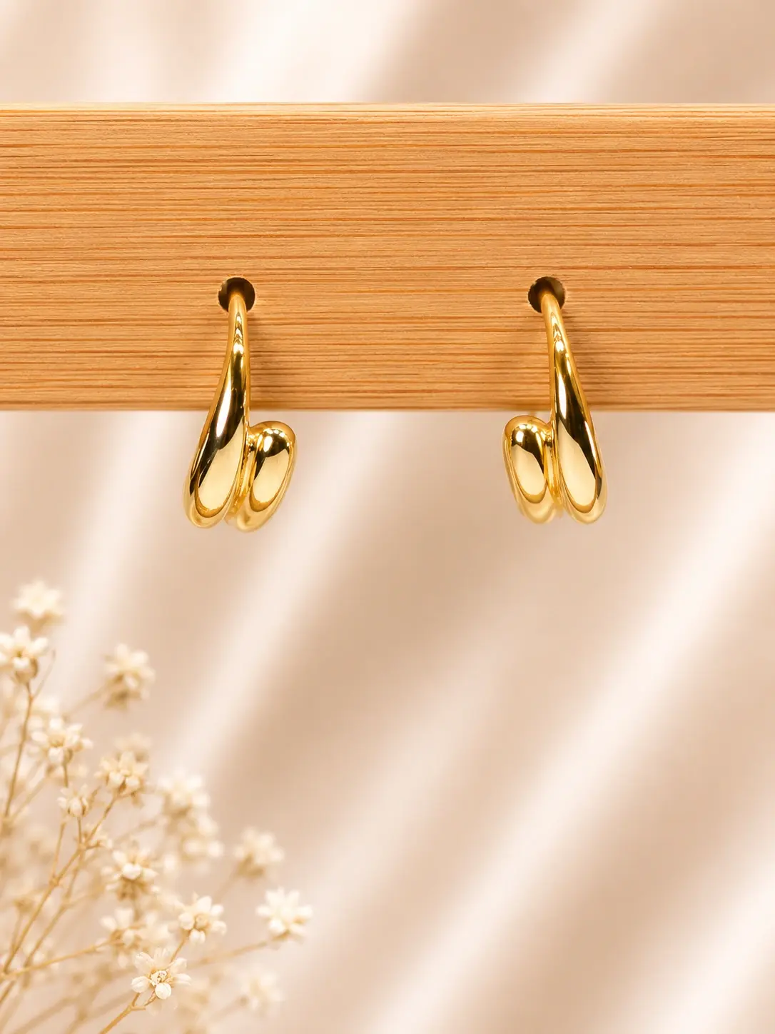 Gold Double Loop Hoop Earrings with polished curved sculptural design