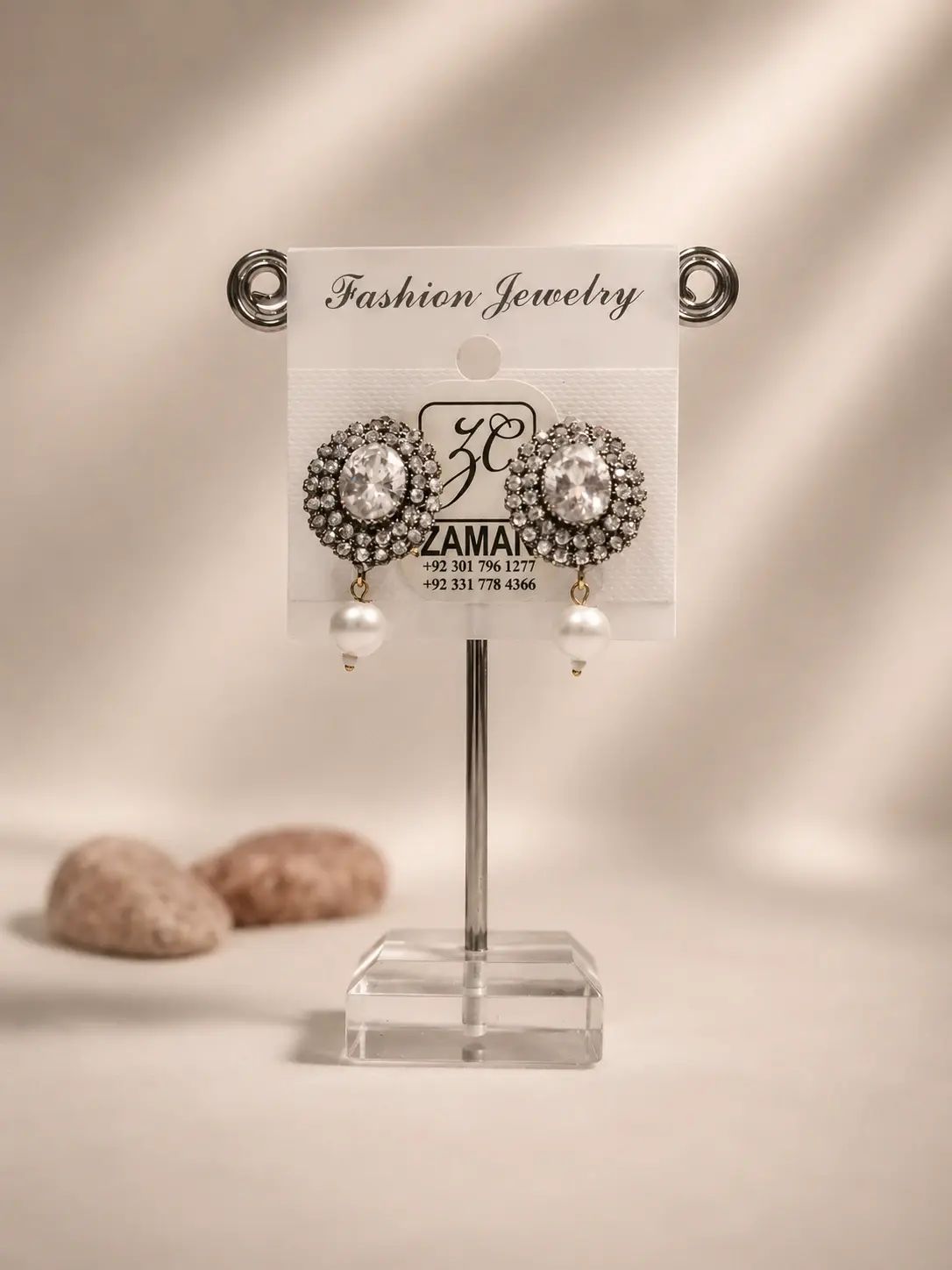 Silver Oval Bead Drop Earrings with layered clear stones and white hanging beads