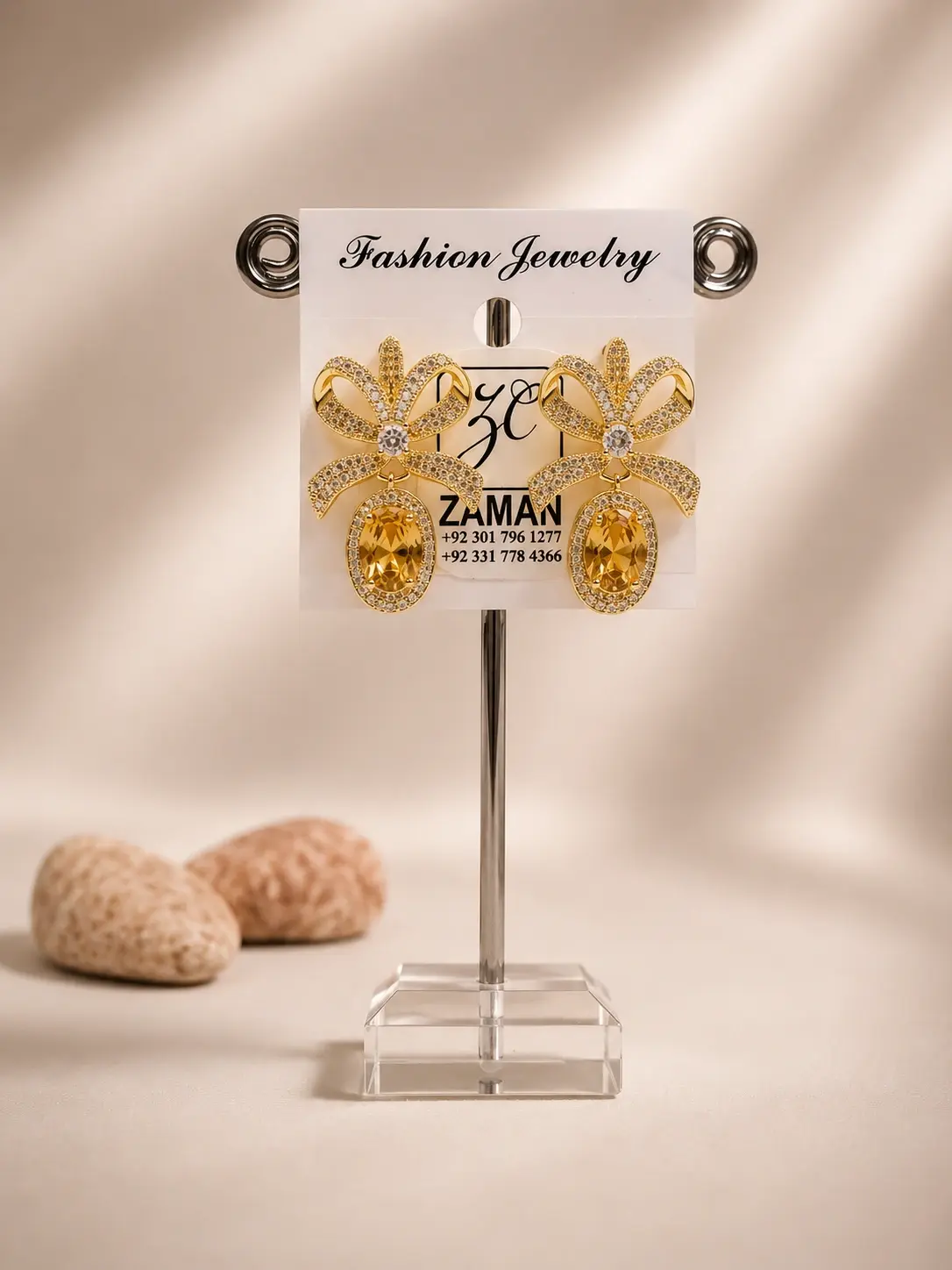 golden yellow bow statement drop earrings with sparkling ribbon tops