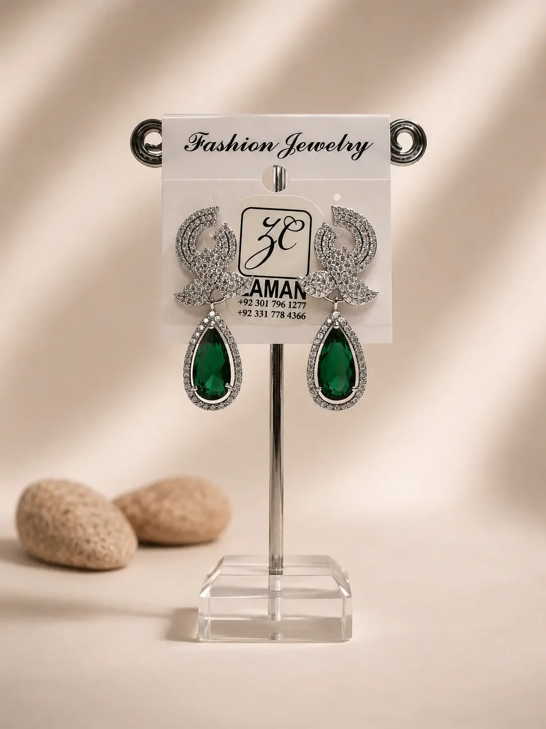 green teardrop silver ribbon earrings with sparkling halo borders