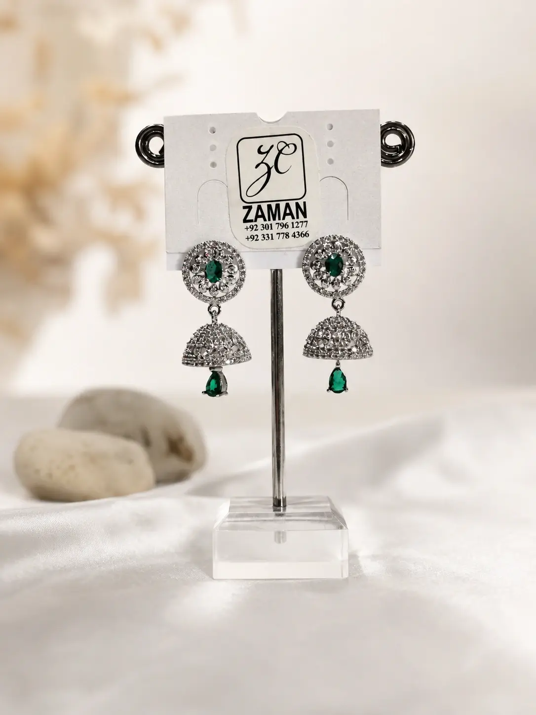 green stone silver dome jhumka earrings with teardrop hanging accents