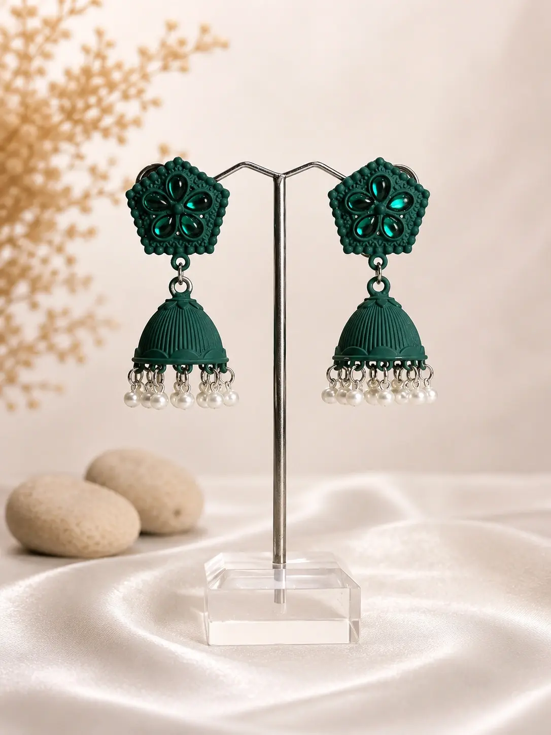 emerald green floral pearl jhumka earrings with textured domes and cream bead fringe