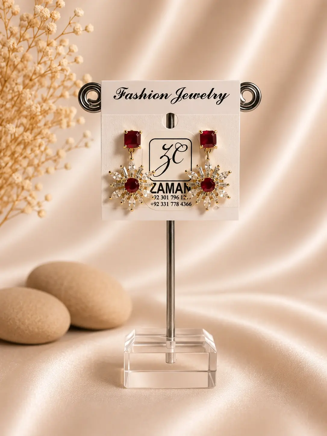 red starburst crystal drop earrings with gold-tone floral frame