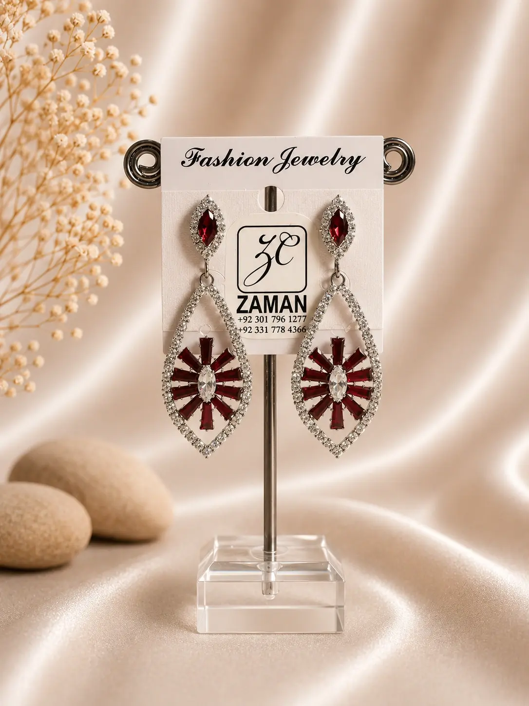 red sunburst marquise drop earrings with sparkling silver-tone frame