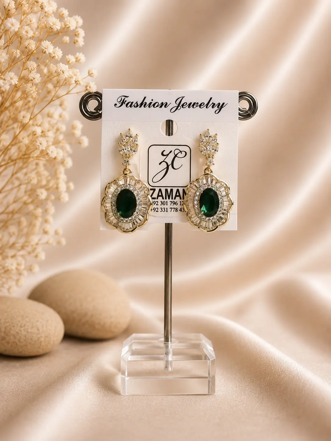 emerald green oval stone drop earrings with sparkling gold-tone frame