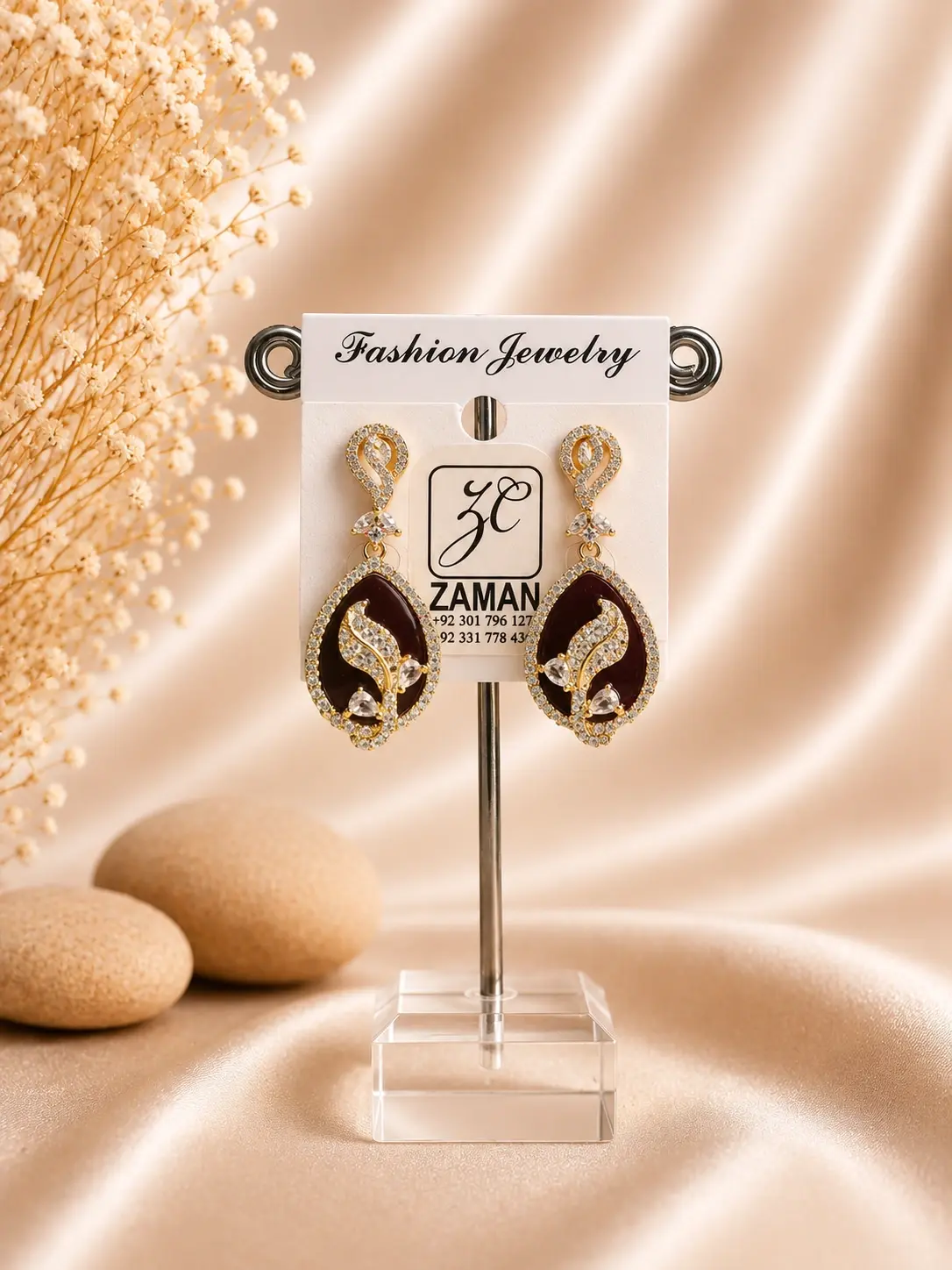 maroon teardrop stone earrings with sparkling gold-tone frame