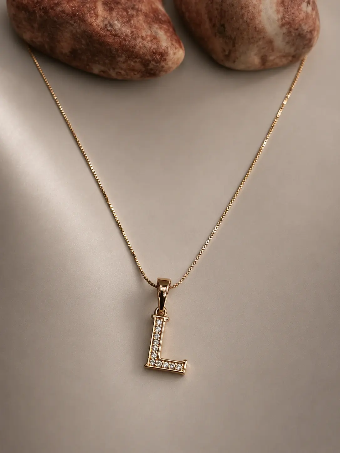 gold L initial stone necklace with sparkling letter pendant