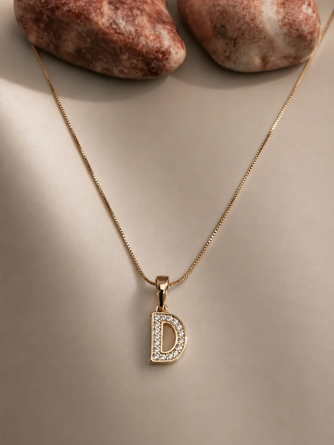 gold D initial stone necklace with sparkling letter pendant