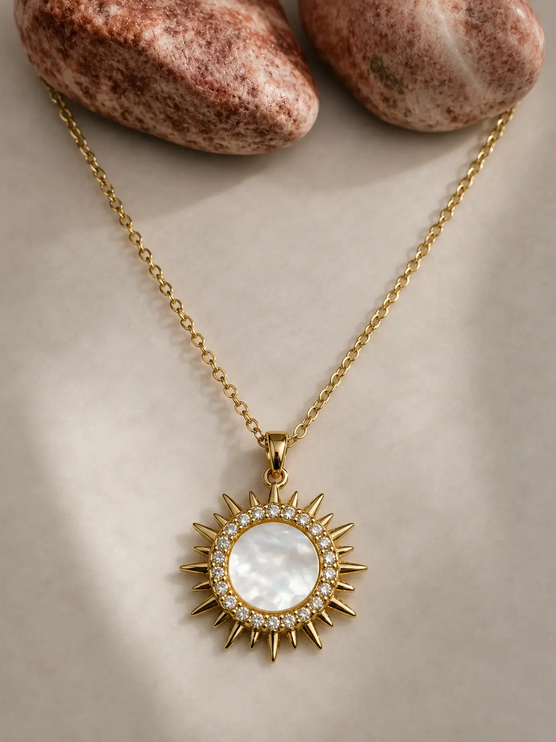 gold white sunburst pendant necklace with clear stone halo