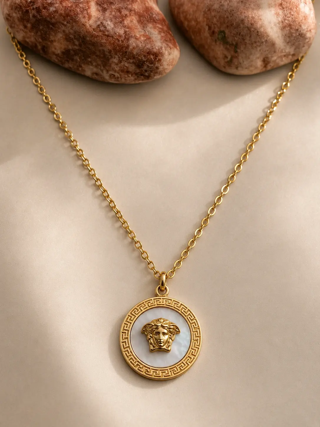 gold white Greek medallion necklace with round sculpted pendant