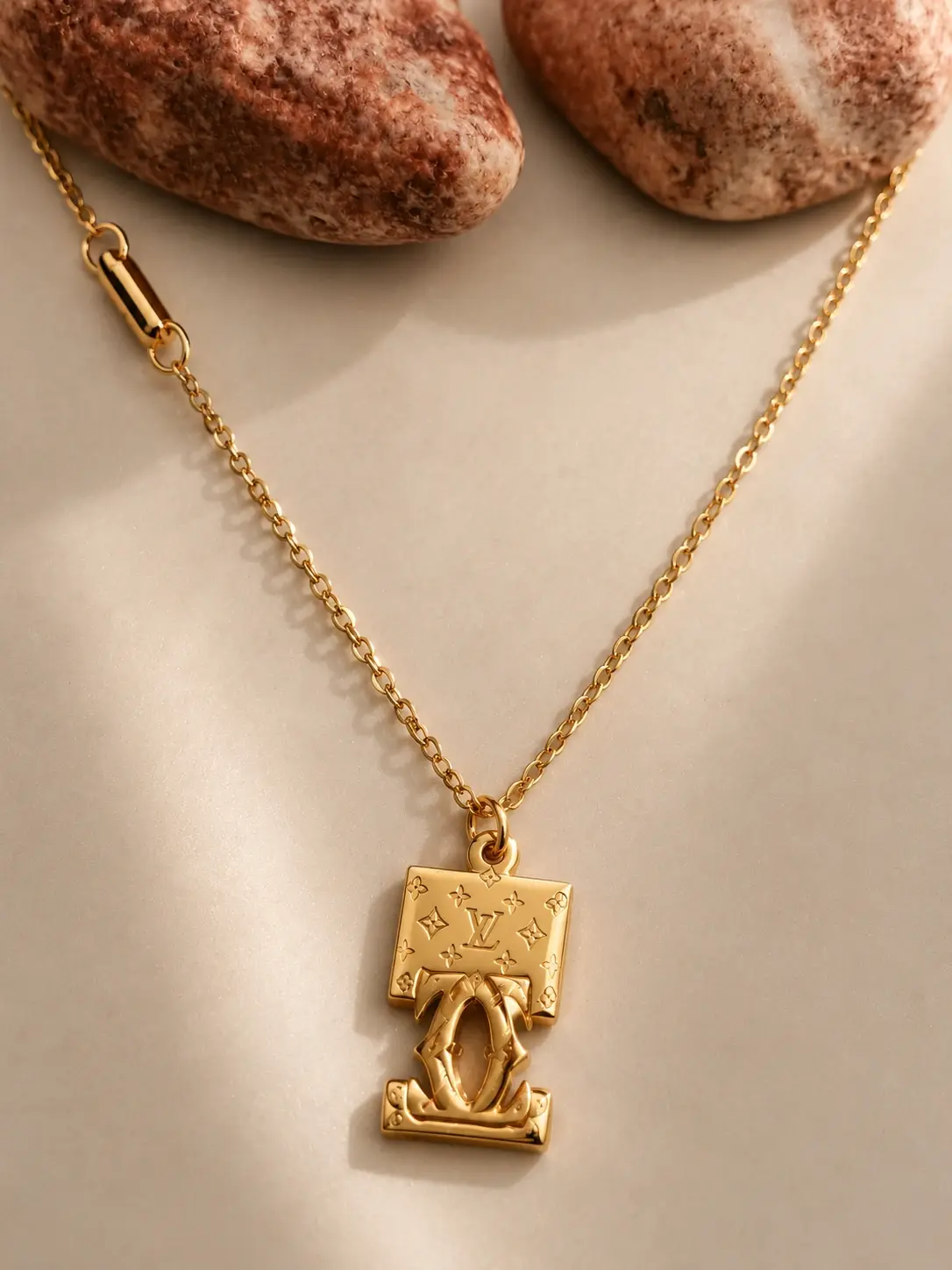 gold geometric monogram necklace with sculpted vertical pendant