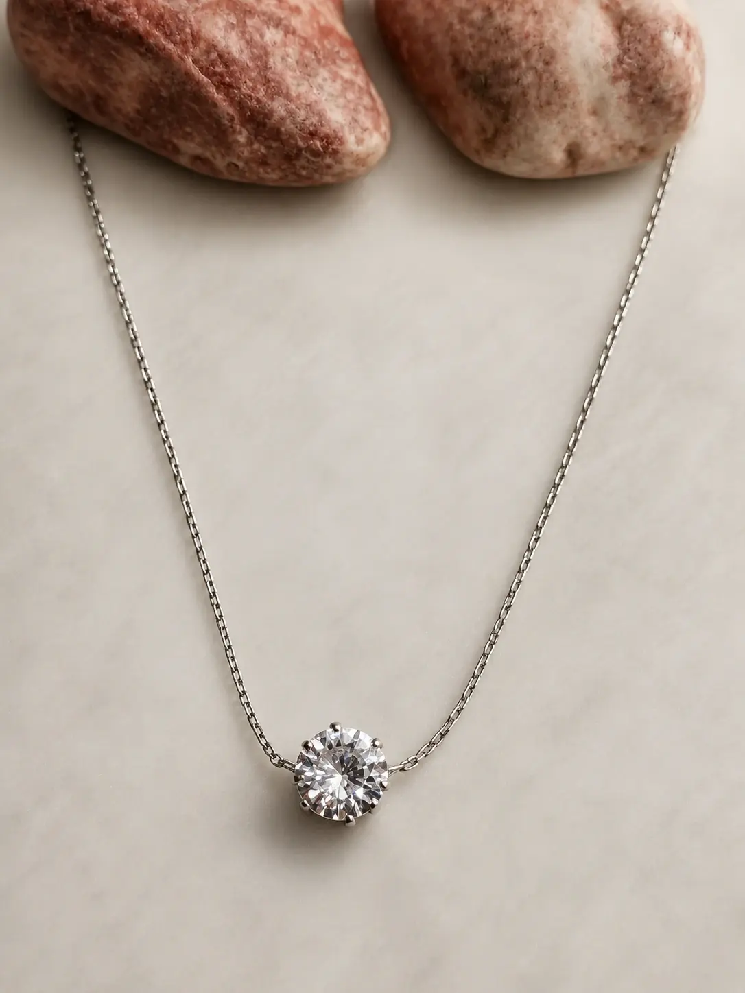 silver round stone necklace with faceted clear centerpiece