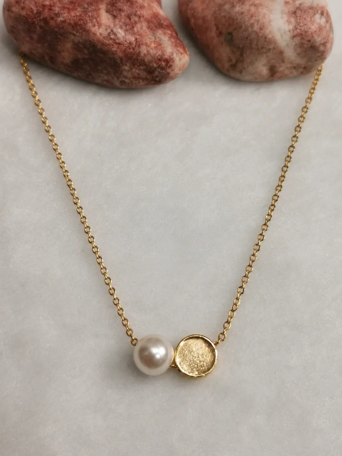 gold pearl style disc necklace with textured round pendant