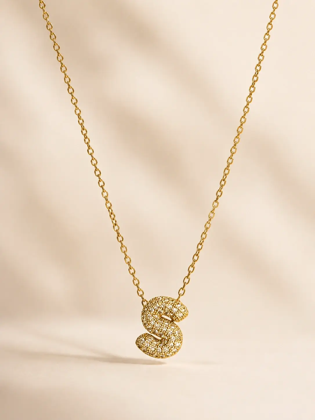 gold S initial necklace with clear accent letter pendant