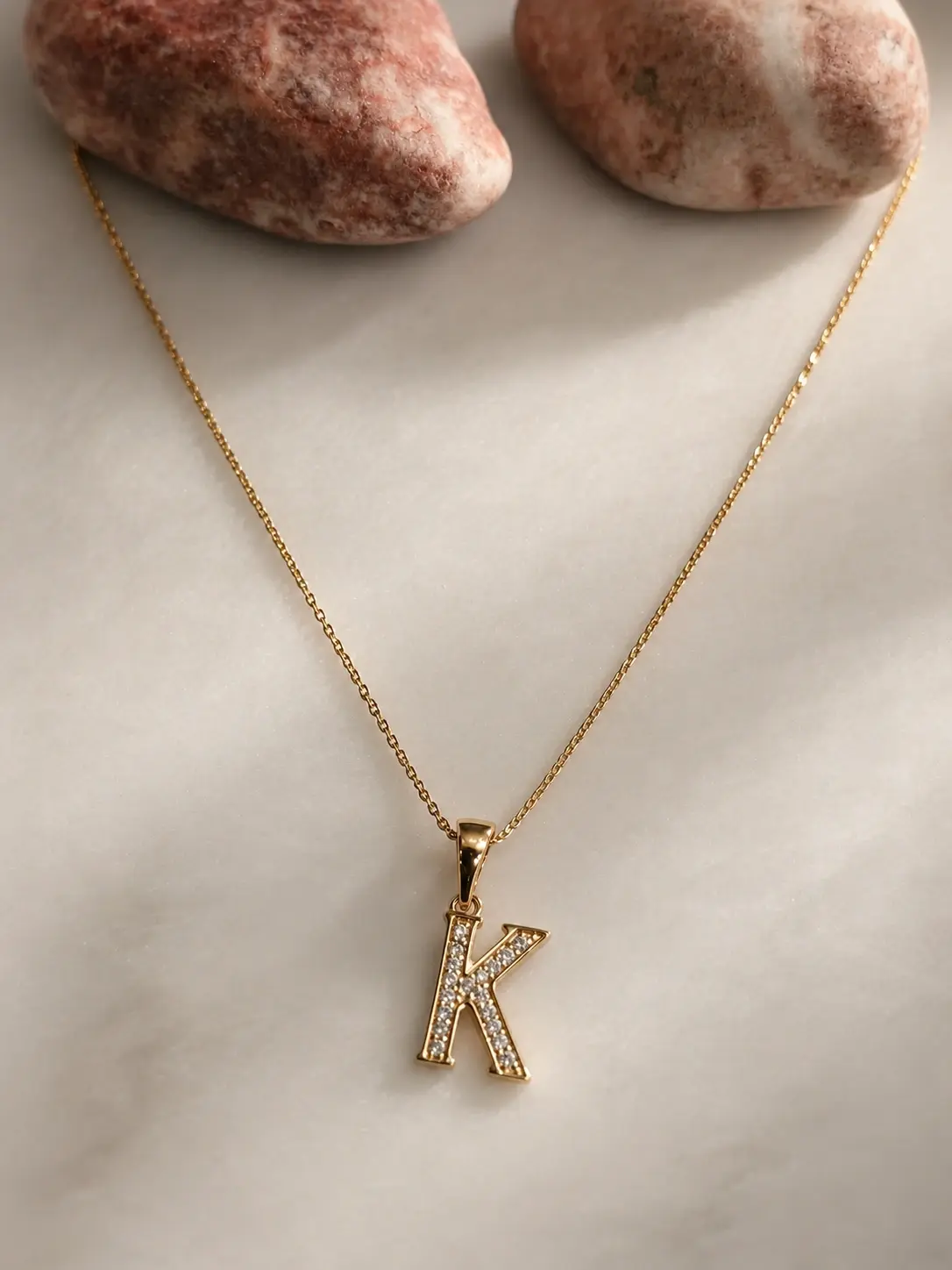 gold K initial necklace with clear accent letter pendant