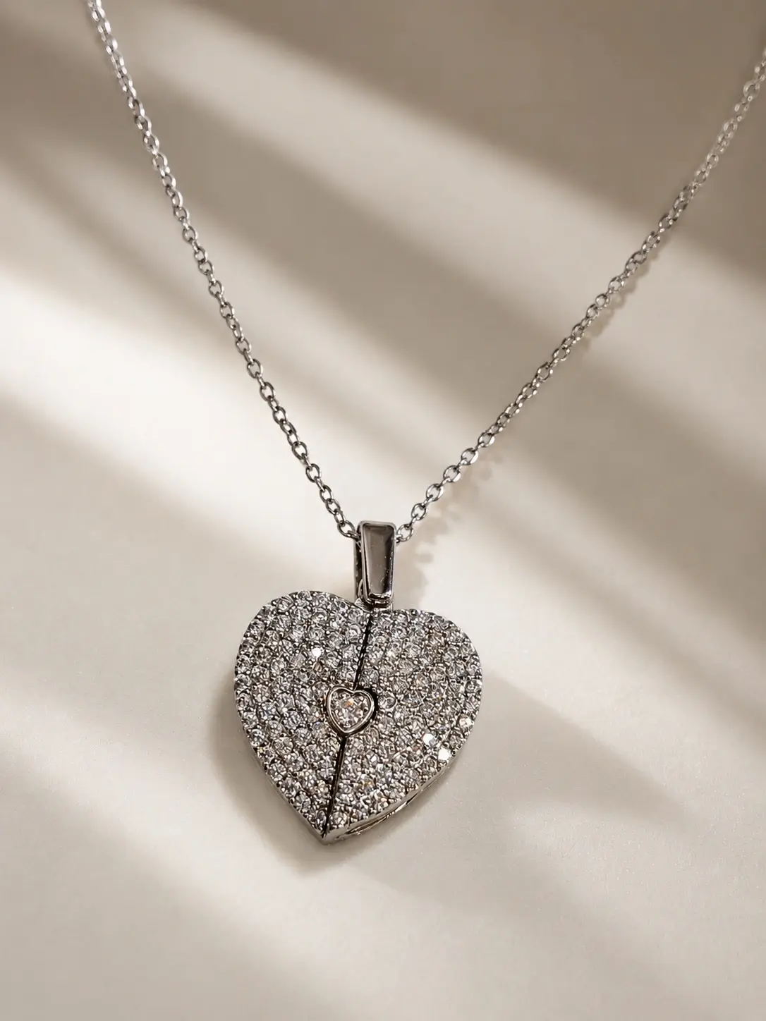 silver pavé heart necklace with small center heart accent