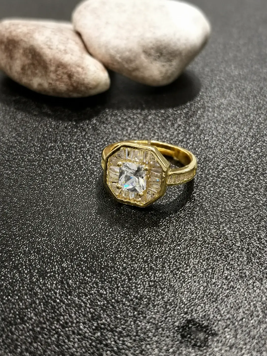 gold tone clear rectangular octagonal halo ring with baguette accents