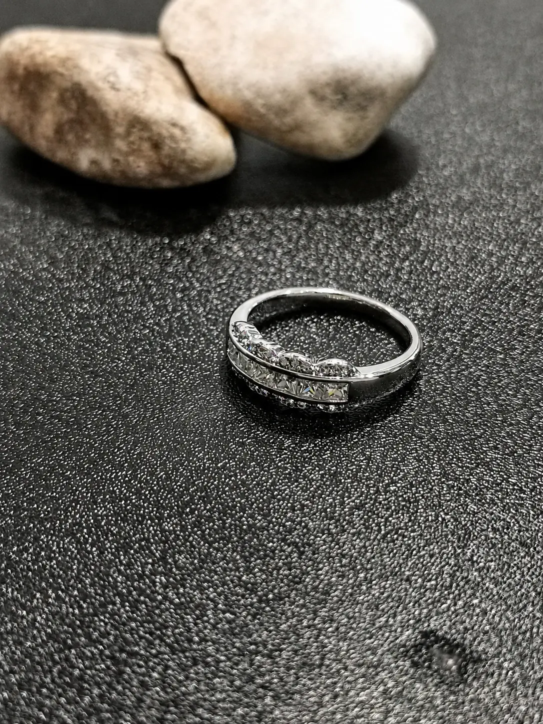 silver tone wave bypass stone ring with clear baguette accents
