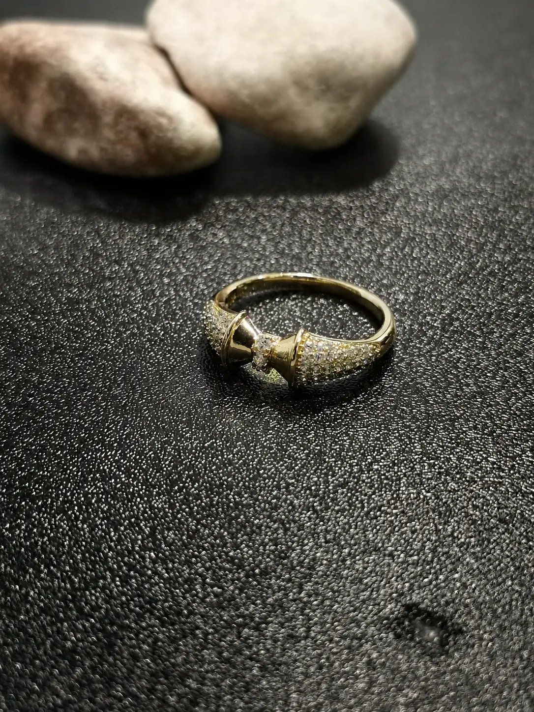 gold tone bow knot stone ring with clear stone accents