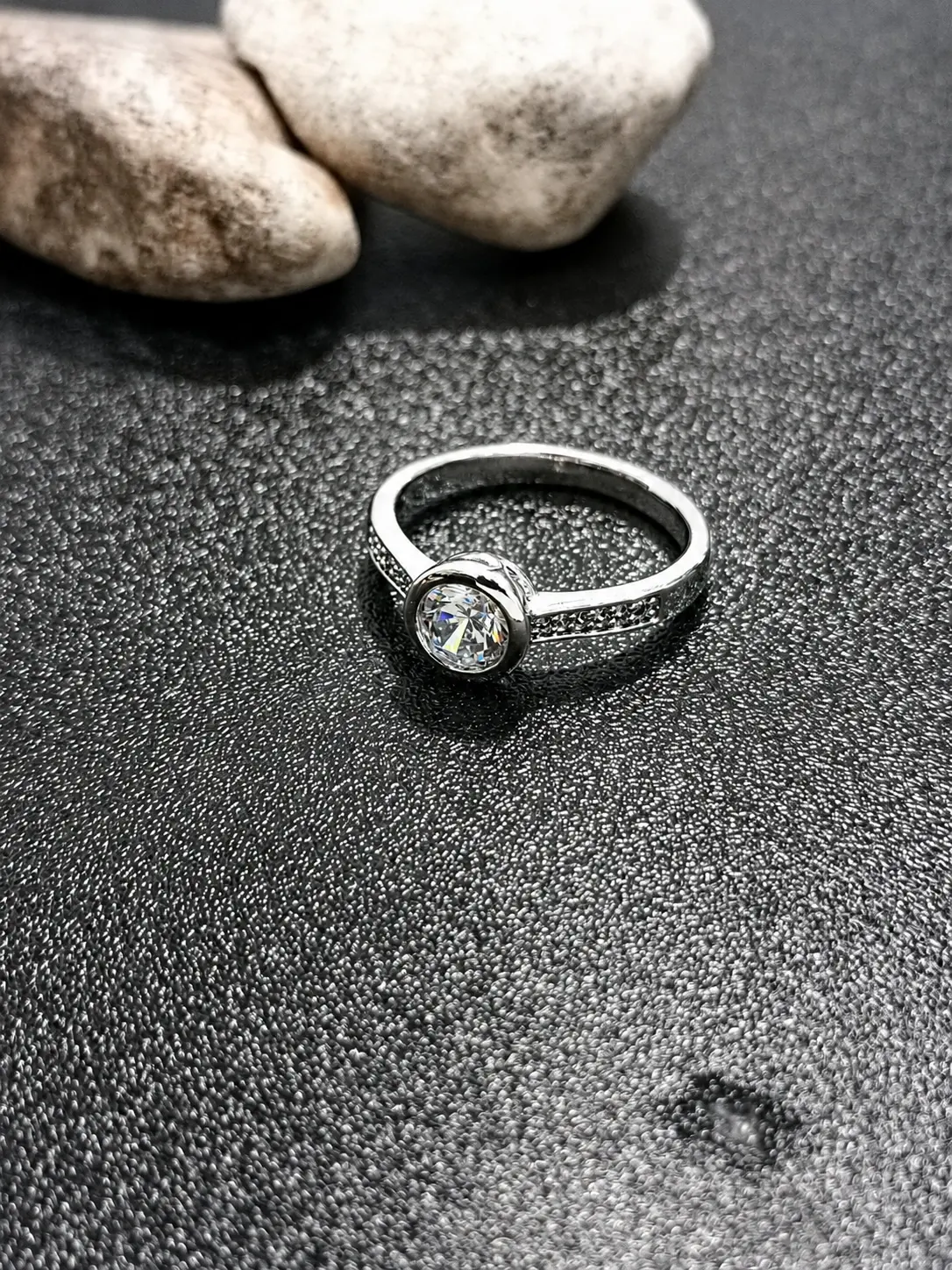 silver tone round bezel solitaire ring with clear centre stone